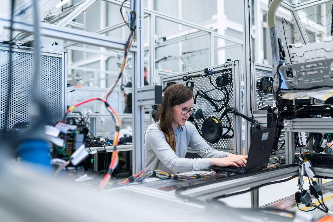 Engineers in a modern manufacturing facility